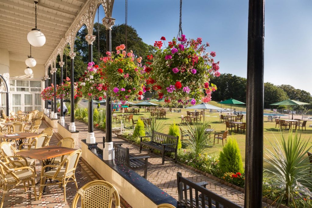 Image of the Langstone Cliff Hotel, showing outdoor seating areas. 