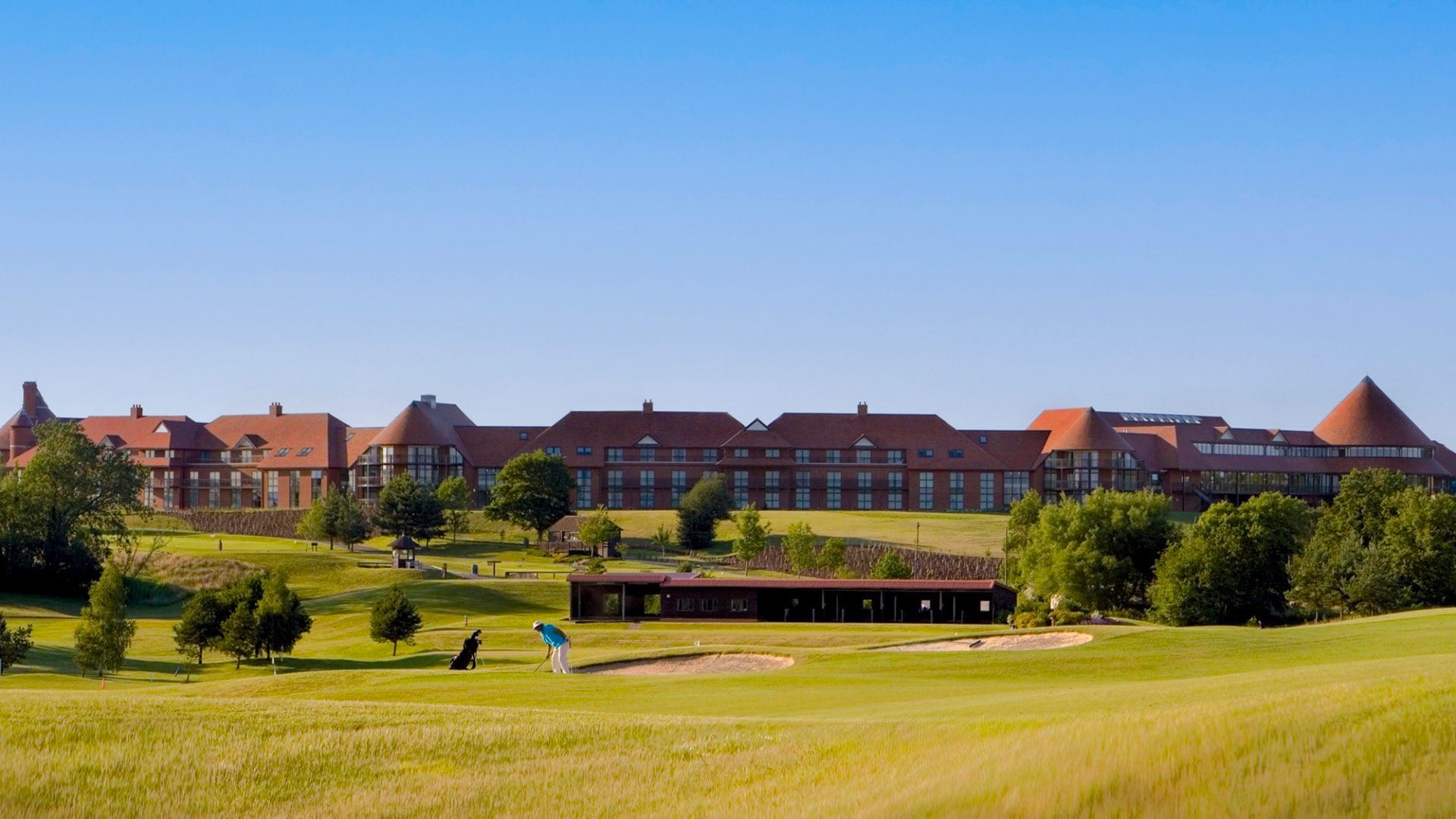 Image of EAST SUSSEX NATIONAL HOTEL course with man playing golf