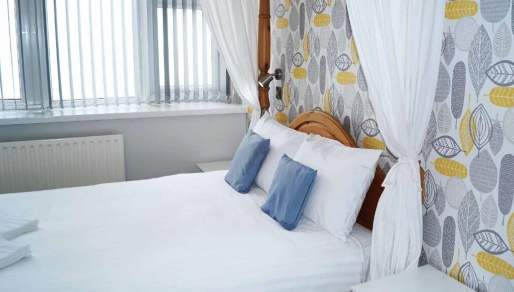 An image of a bedroom at the Blue Waters Hotel.